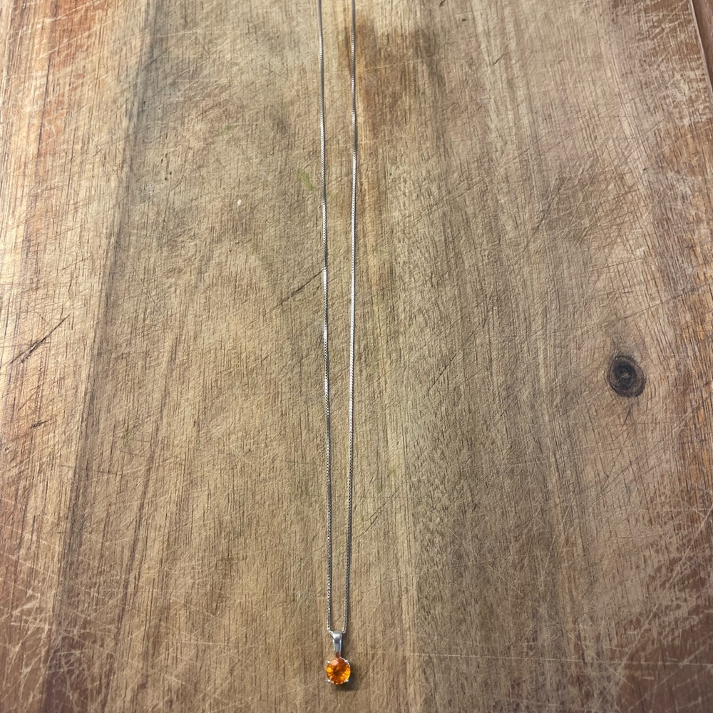 Orange sapphire pendant on 14 my white gold chain